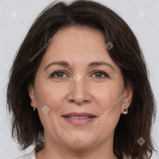 Joyful white adult female with medium  brown hair and brown eyes