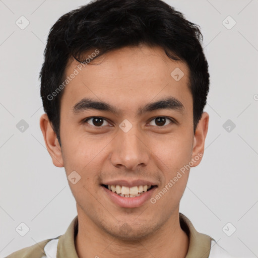 Joyful latino young-adult male with short  brown hair and brown eyes