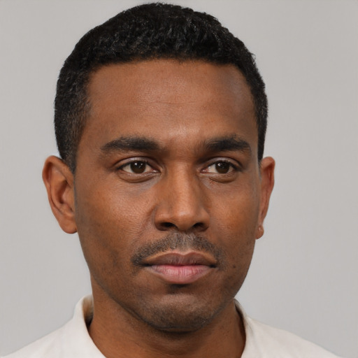 Neutral black young-adult male with short  black hair and brown eyes