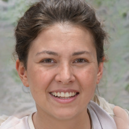 Joyful white adult female with short  brown hair and brown eyes