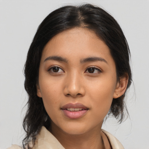Joyful asian young-adult female with medium  black hair and brown eyes