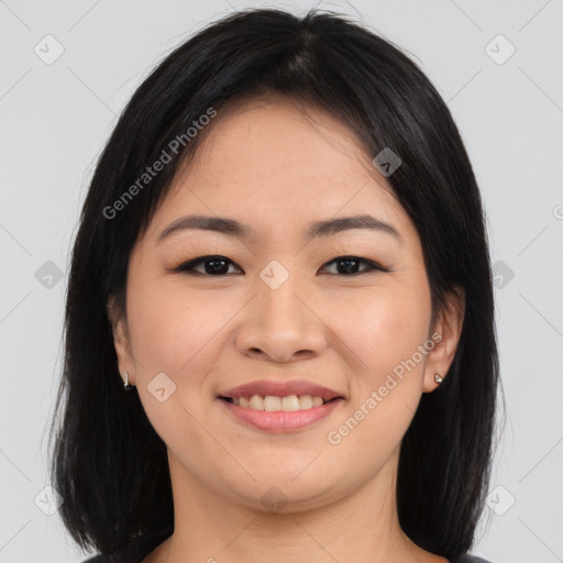 Joyful asian young-adult female with long  brown hair and brown eyes