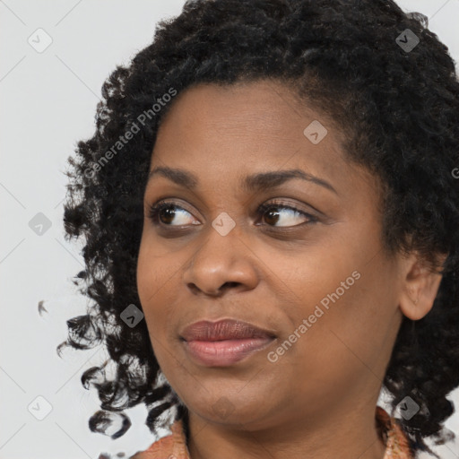 Joyful black young-adult female with medium  black hair and brown eyes