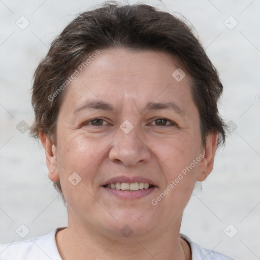 Joyful white adult female with short  brown hair and brown eyes