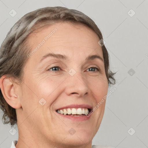 Joyful white adult female with short  brown hair and brown eyes