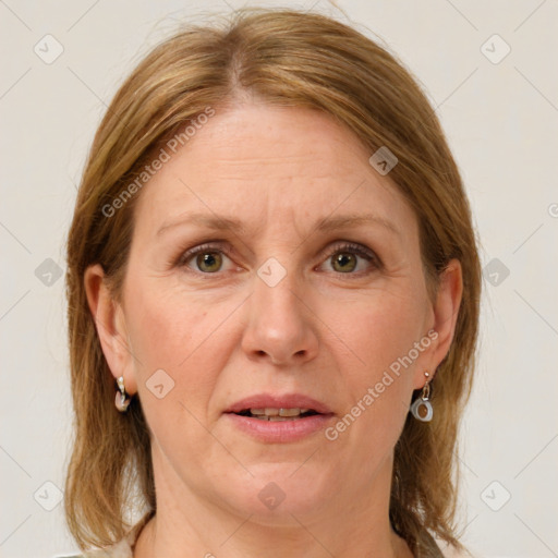 Joyful white adult female with medium  brown hair and grey eyes