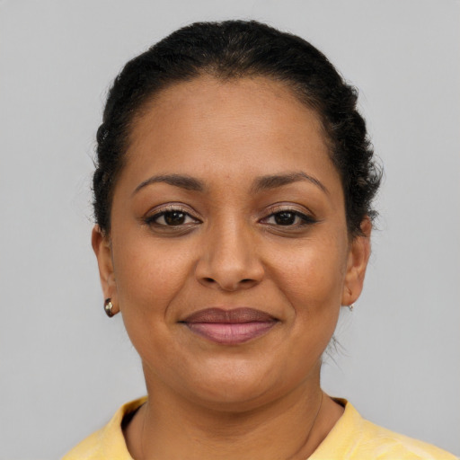 Joyful latino young-adult female with short  brown hair and brown eyes