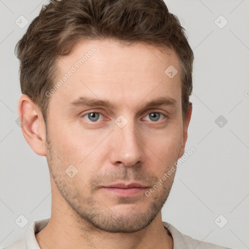 Neutral white young-adult male with short  brown hair and grey eyes