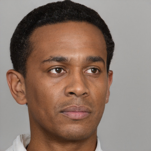 Neutral black young-adult male with short  brown hair and brown eyes