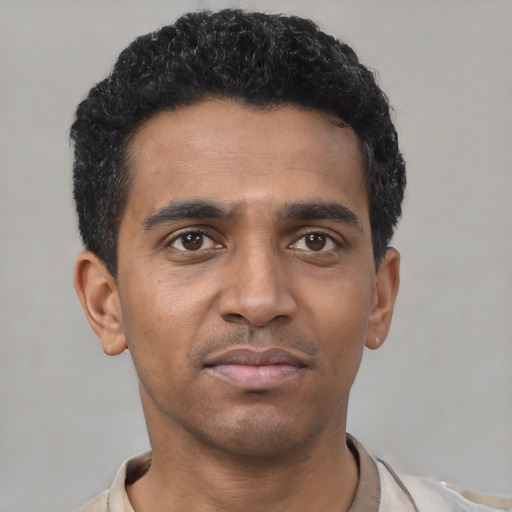 Neutral black young-adult male with short  black hair and brown eyes
