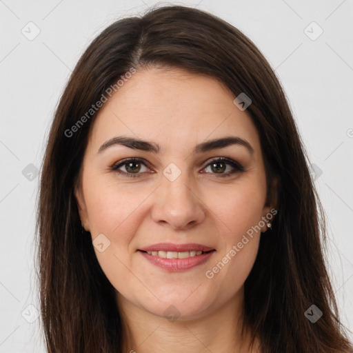 Joyful white young-adult female with long  brown hair and brown eyes