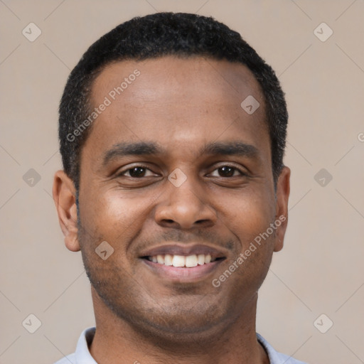 Joyful latino young-adult male with short  black hair and brown eyes