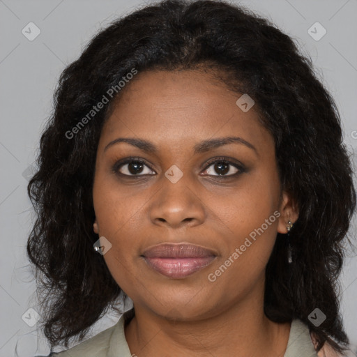 Joyful black young-adult female with long  brown hair and brown eyes