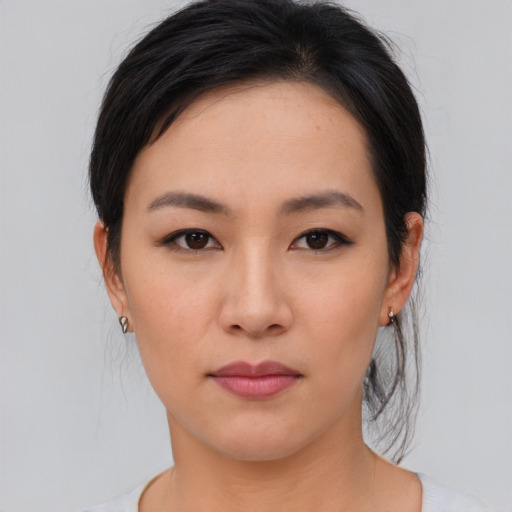 Neutral asian young-adult female with medium  brown hair and brown eyes