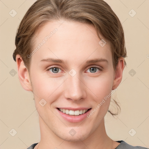 Joyful white young-adult female with short  brown hair and grey eyes