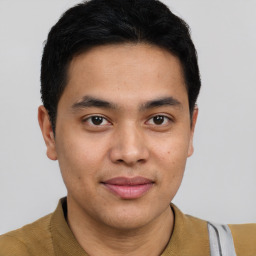 Joyful latino young-adult male with short  brown hair and brown eyes