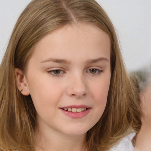 Joyful white child female with long  brown hair and brown eyes