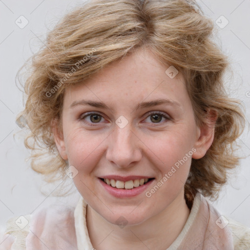 Joyful white young-adult female with medium  brown hair and blue eyes