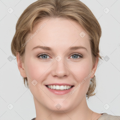 Joyful white young-adult female with medium  brown hair and blue eyes