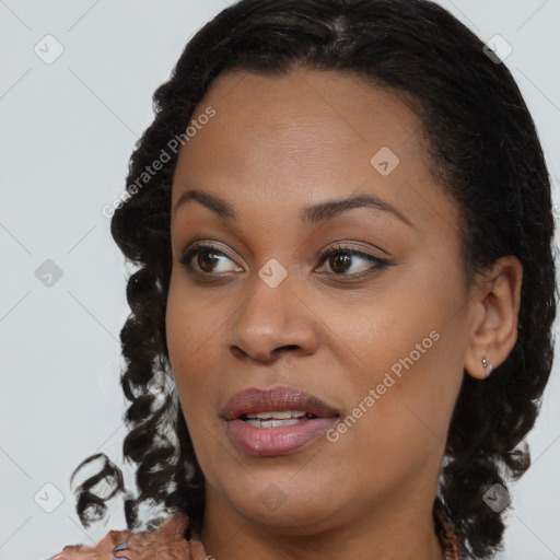 Joyful black young-adult female with medium  brown hair and brown eyes