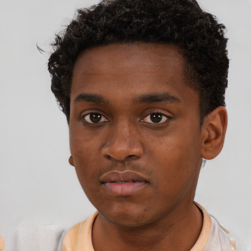 Neutral black young-adult male with short  brown hair and brown eyes