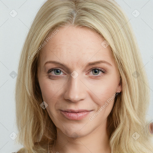 Joyful white young-adult female with long  brown hair and blue eyes