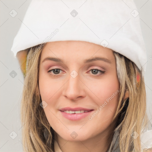 Joyful white young-adult female with medium  brown hair and blue eyes