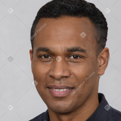 Joyful latino adult male with short  black hair and brown eyes