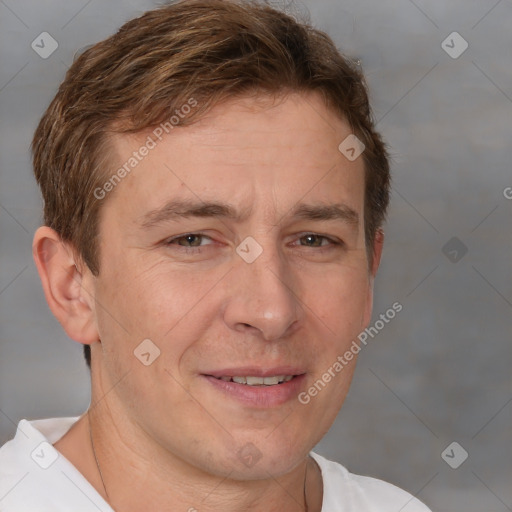 Joyful white adult male with short  brown hair and brown eyes