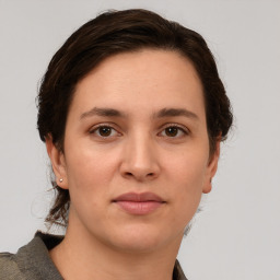 Neutral white young-adult female with short  brown hair and brown eyes