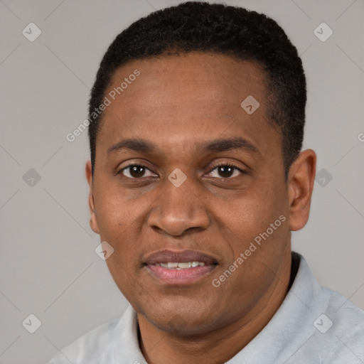 Joyful black adult male with short  black hair and brown eyes