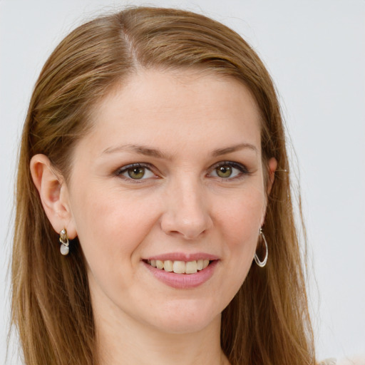 Joyful white young-adult female with long  brown hair and blue eyes