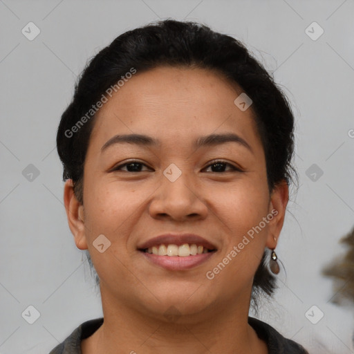 Joyful latino young-adult female with short  brown hair and brown eyes