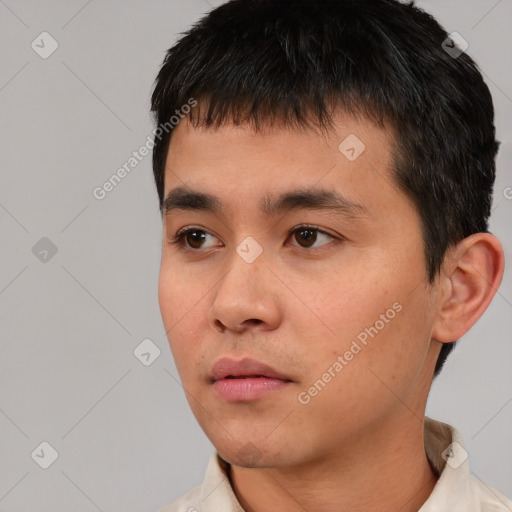 Neutral white young-adult male with short  black hair and brown eyes