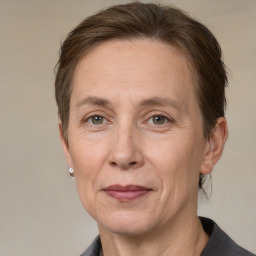 Joyful white adult female with medium  brown hair and grey eyes