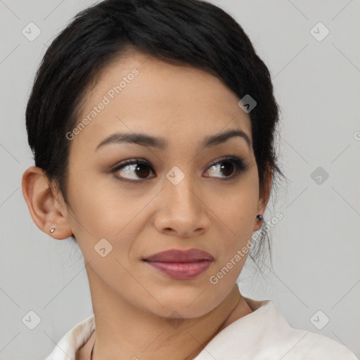 Joyful latino young-adult female with medium  brown hair and brown eyes