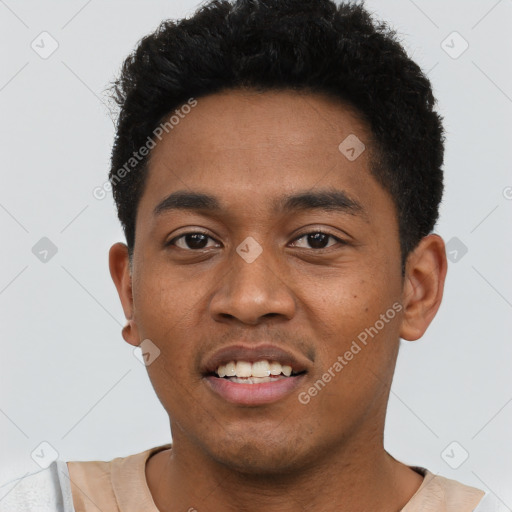 Joyful black young-adult male with short  black hair and brown eyes