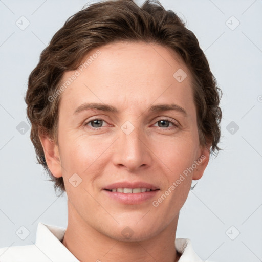 Joyful white adult female with short  brown hair and grey eyes