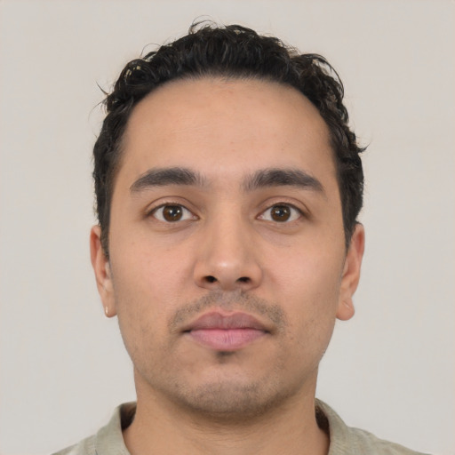 Neutral latino young-adult male with short  black hair and brown eyes