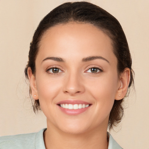 Joyful white young-adult female with medium  brown hair and brown eyes