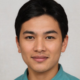 Joyful asian young-adult male with short  black hair and brown eyes