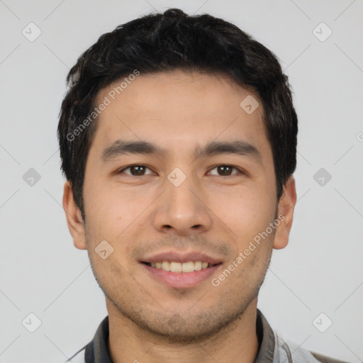 Joyful white young-adult male with short  black hair and brown eyes