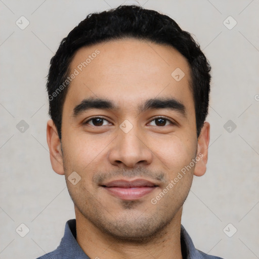 Joyful latino young-adult male with short  black hair and brown eyes