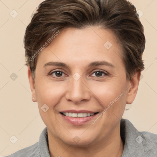 Joyful white adult female with short  brown hair and brown eyes