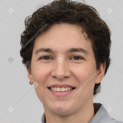 Joyful white adult female with short  brown hair and brown eyes