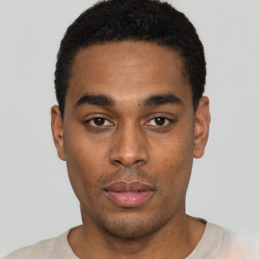 Neutral black young-adult male with short  black hair and brown eyes