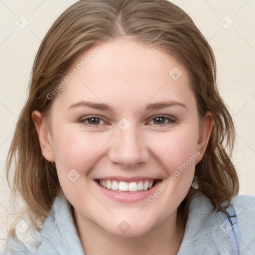 Joyful white young-adult female with medium  brown hair and blue eyes