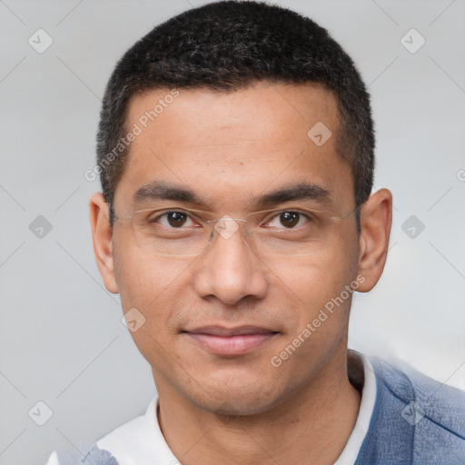 Joyful latino young-adult male with short  brown hair and brown eyes