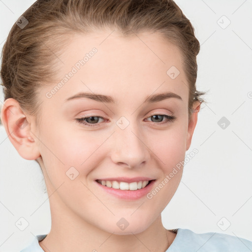 Joyful white young-adult female with short  brown hair and grey eyes