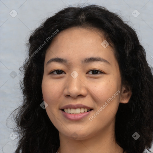 Joyful asian young-adult female with long  brown hair and brown eyes